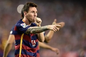 Barcelona's Argentinian forward Lionel Messi celebrates after scoring during the Spanish league football match Club Atletico de Madrid vs FC Barcelona at the Vicente Calderon stadium in Madrid on September 12, 2015.   AFP PHOTO/ GERARD JULIEN